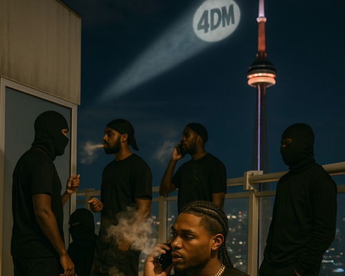 Group of people on a rooftop at night with the CN Tower in the background